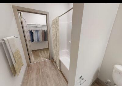 Furnished hall bathroom and closet photo in the Lombardy 2 bedroom 2 bathroom floor plan at the brand new luxury Marcella at Gateway community in Bon Air Richmond Virginia