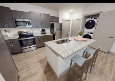 Furnished kitchen and laundry photo in the Lombardy 2 bedroom 2 bathroom floor plan at the brand new luxury Marcella at Gateway community in Bon Air Richmond Virginia